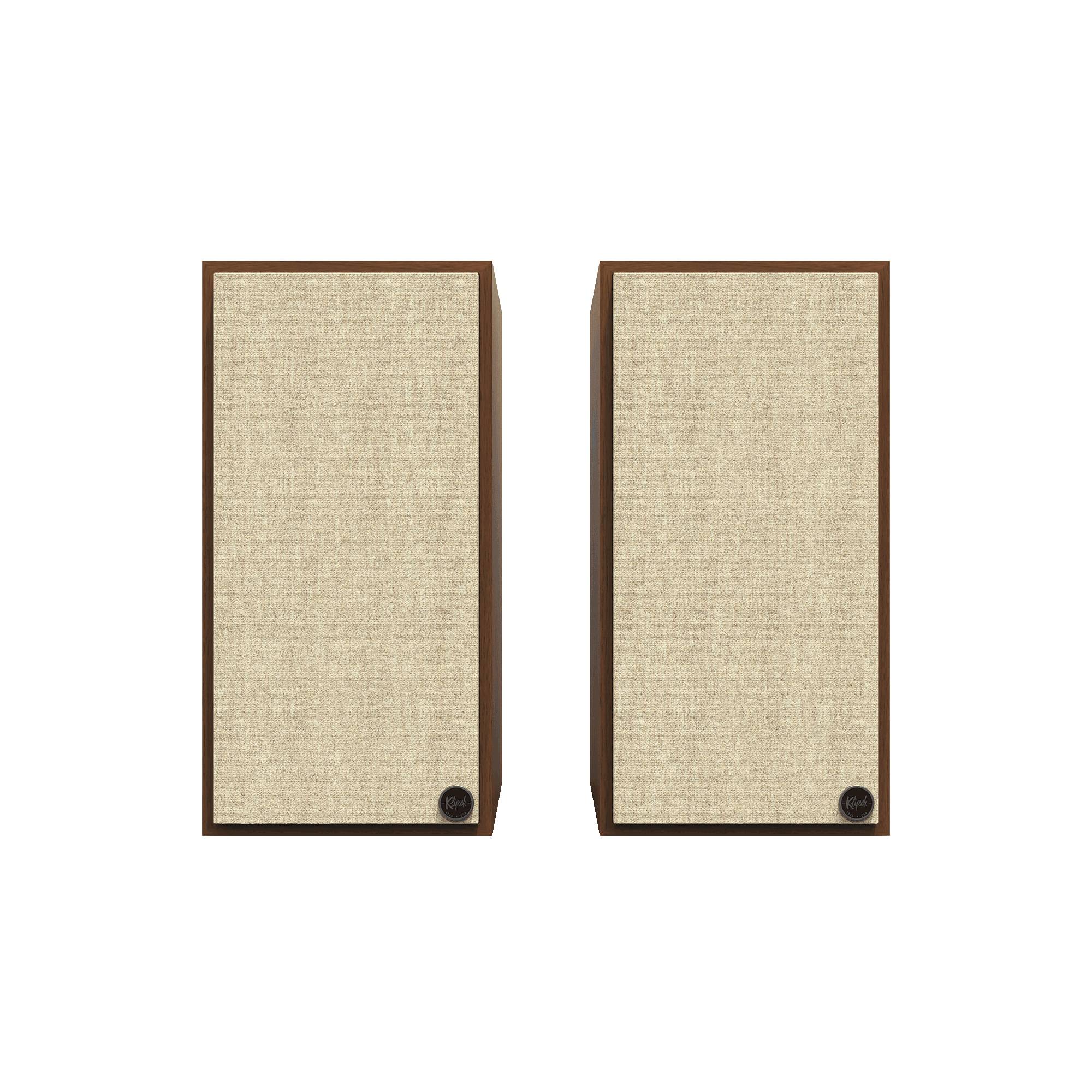 Boxe active Klipsch The Nines, vedere frontală, finisaj nuc, grile frontale textile bej, logo vizibil.