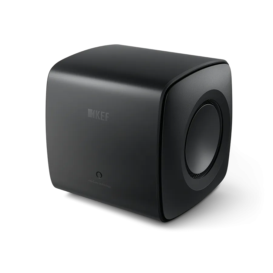 Subwoofer KEF KC62 Carbon Black, vedere frontală laterală, unitate activă vizibilă, 1000W, 2x16.5cm.