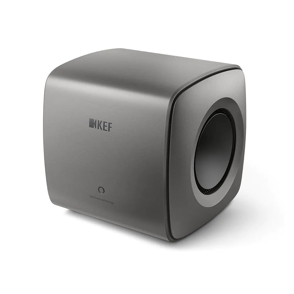 Subwoofer KEF KC62 Titan, vedere frontală laterală, culoare gri, difuzor lateral de 16.5 cm vizibil.