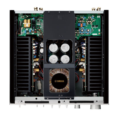 Vedere interioară a amplificatorului Yamaha A-S1200, evidențiind componentele electronice și transformatorul central.