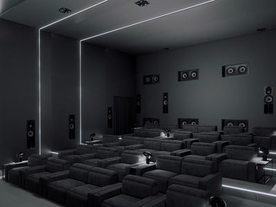 Sistem home theater cu subwoofer Focal Cinema Sub, vedere laterală, boxe încorporate și scaune negre.