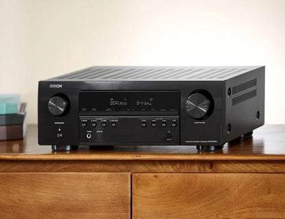 Receiver Denon AVR-S770H, vedere stânga, negru, butoane control volum și sursă, afișaj digital activ.