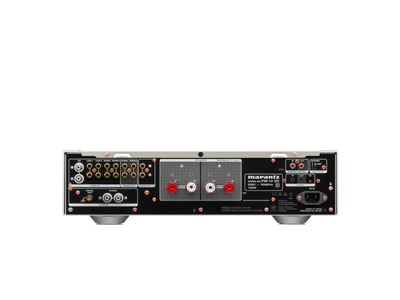 Panoul din spate al amplificatorului Marantz PM-12 SE argintiu, cu intrări audio și conectori difuzoare.