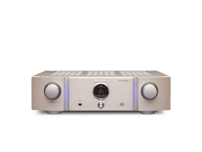 Amplificator Marantz PM-12 SE argintiu, vedere frontală, cu butoane de volum și afișaj central vizibile.