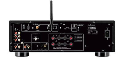 Spate receiver Yamaha R-N1000A, negru, arată conexiuni analogice, digitale, HDMI, USB și rețea.