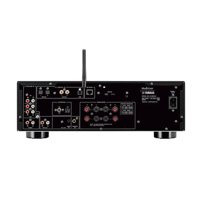 Spatele receiverului Yamaha R-N800A argintiu, arătând conexiunile digitale și analogice, incluzând porturi USB, coaxiale și optice.