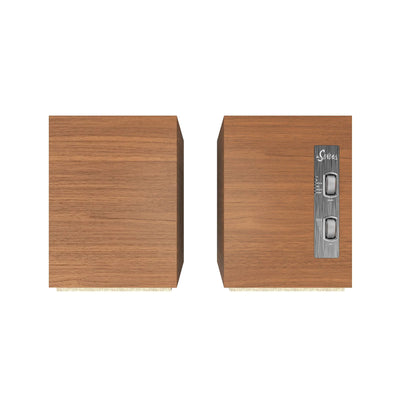 Vedere de sus a boxelor active Klipsch The Sevens culoare Walnut, cu panou de control vizibil pe una.